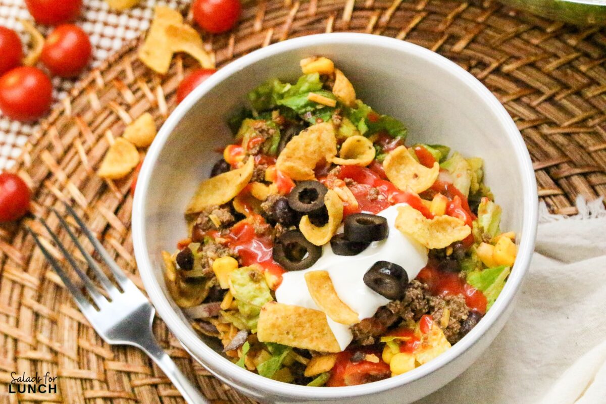 Frito Taco Salad Recipe 16 - Frito Taco Salad is a fun, flavorful, and easy dish that always gets rave reviews. Whether you're bringing it to a backyard BBQ, potluck, or just making it for a weeknight meal, it’s a guaranteed favorite. The combination of fresh ingredients, bold taco seasoning, and crispy Fritos makes every bite delicious. Give this recipe a try and watch it disappear in no time!