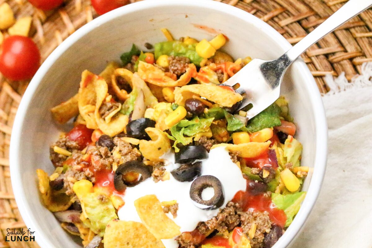 Frito Taco Salad Recipe 28 - Frito Taco Salad is a fun, flavorful, and easy dish that always gets rave reviews. Whether you're bringing it to a backyard BBQ, potluck, or just making it for a weeknight meal, it’s a guaranteed favorite. The combination of fresh ingredients, bold taco seasoning, and crispy Fritos makes every bite delicious. Give this recipe a try and watch it disappear in no time!