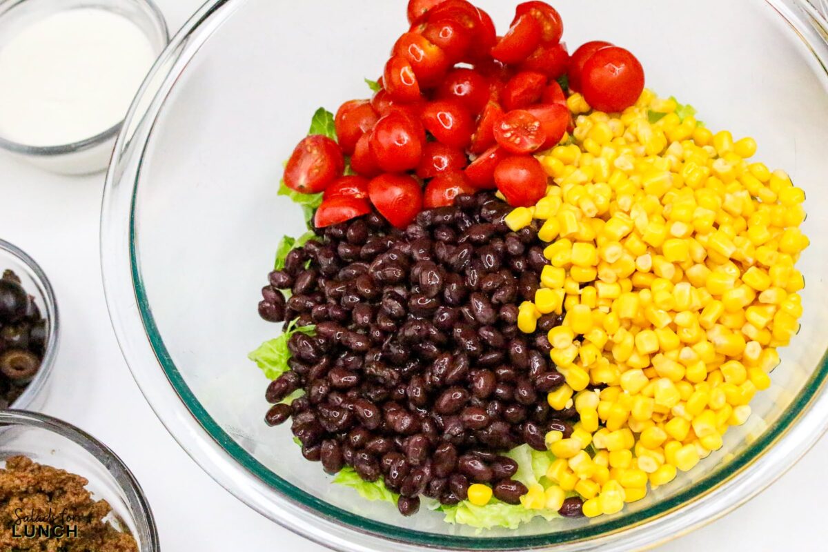 Frito Taco Salad Recipe 7 - Frito Taco Salad is a fun, flavorful, and easy dish that always gets rave reviews. Whether you're bringing it to a backyard BBQ, potluck, or just making it for a weeknight meal, it’s a guaranteed favorite. The combination of fresh ingredients, bold taco seasoning, and crispy Fritos makes every bite delicious. Give this recipe a try and watch it disappear in no time!